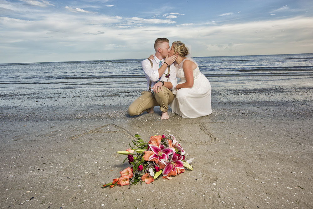 SW Florida beach wedding photos with flowers