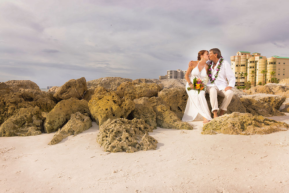 Beach wedding photos on the rocks in SW Florida