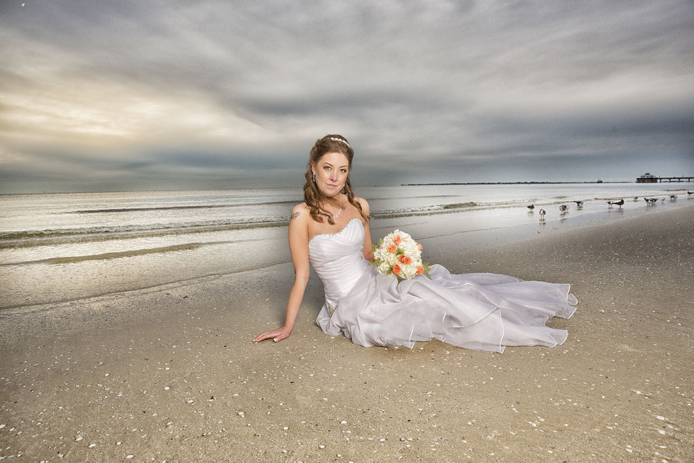 Beach bride wedding photo by Chris Kovaz