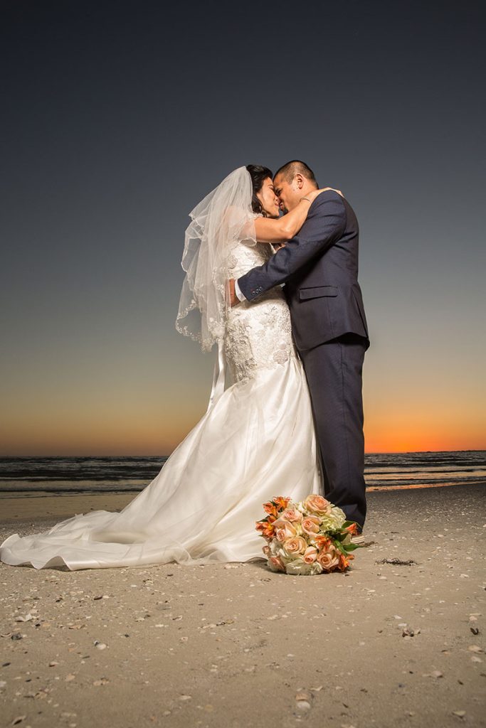 Formal beach wedding photos on the beach by Chris Kovaz